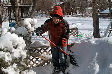 Joseph shoveling snow.