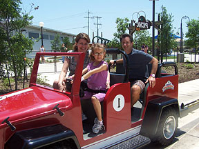 The Weber family seated in a car with Lindsay at the wheel