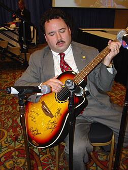 Parnell Diggs playing a guitar.