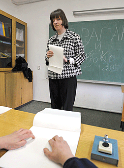 Adrijana�s student follows along in Braille as his teacher speaks.