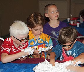 search for frogs and dinosaurs in a pan of shaving cream