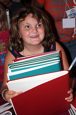 Anna Catherine Walker of Pennsylvania hugs an armload of books