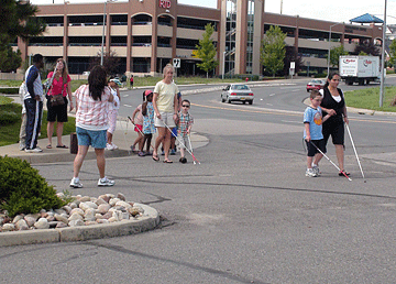 BELL students and staff cross an intersection.