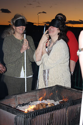 Carlton Cook Walker (on right) learns to grill under sleepshades.