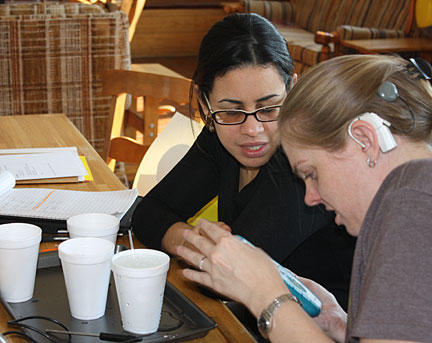 Kim Hingham and Yokasta Urena learn to use accessible science tools.