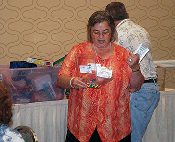 Merry-Noel Chamberlain gives a presentation to parents at an NFB convention.