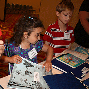 Julia Gebert and her brother, Andrew, have fun at the Braille Book Fair.