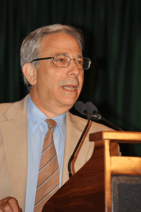 Dan Goldstein speaks at the podium.