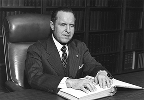Kenneth Jernigan reads at his desk at the Iowa Commission for the Blind.