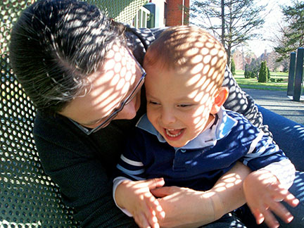 Amber Bobnar and her son, Ivan, play at the park.