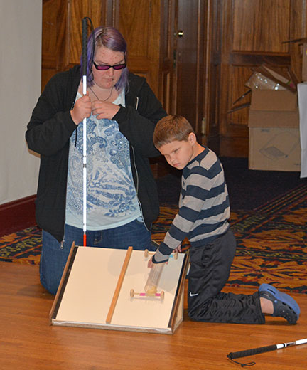 Sierra Schmidt and Dick Oliver test their recycled racer.