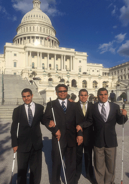 Ollie Cantos and his sons stand in front of the US Capitol.