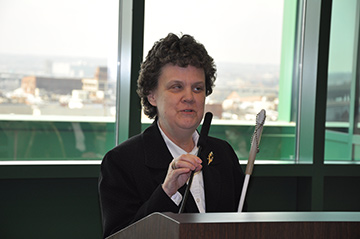 Patricia Maurer speaks at a podium.