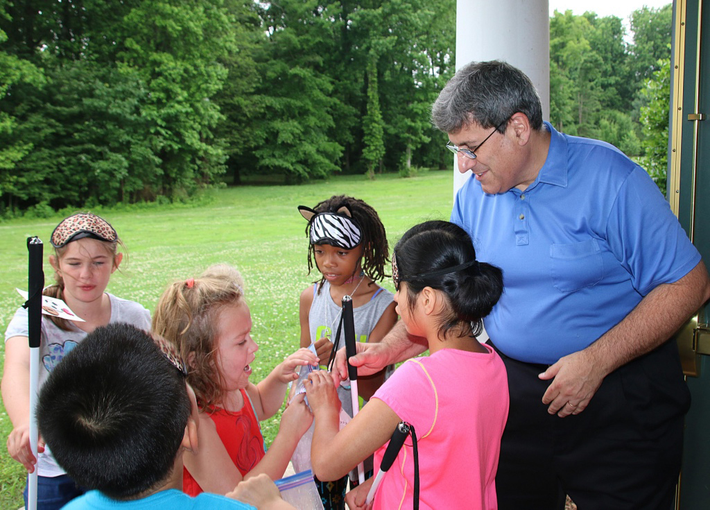 Larry Povinelli supervises students making ice cream at the Alabama BELL Academy.