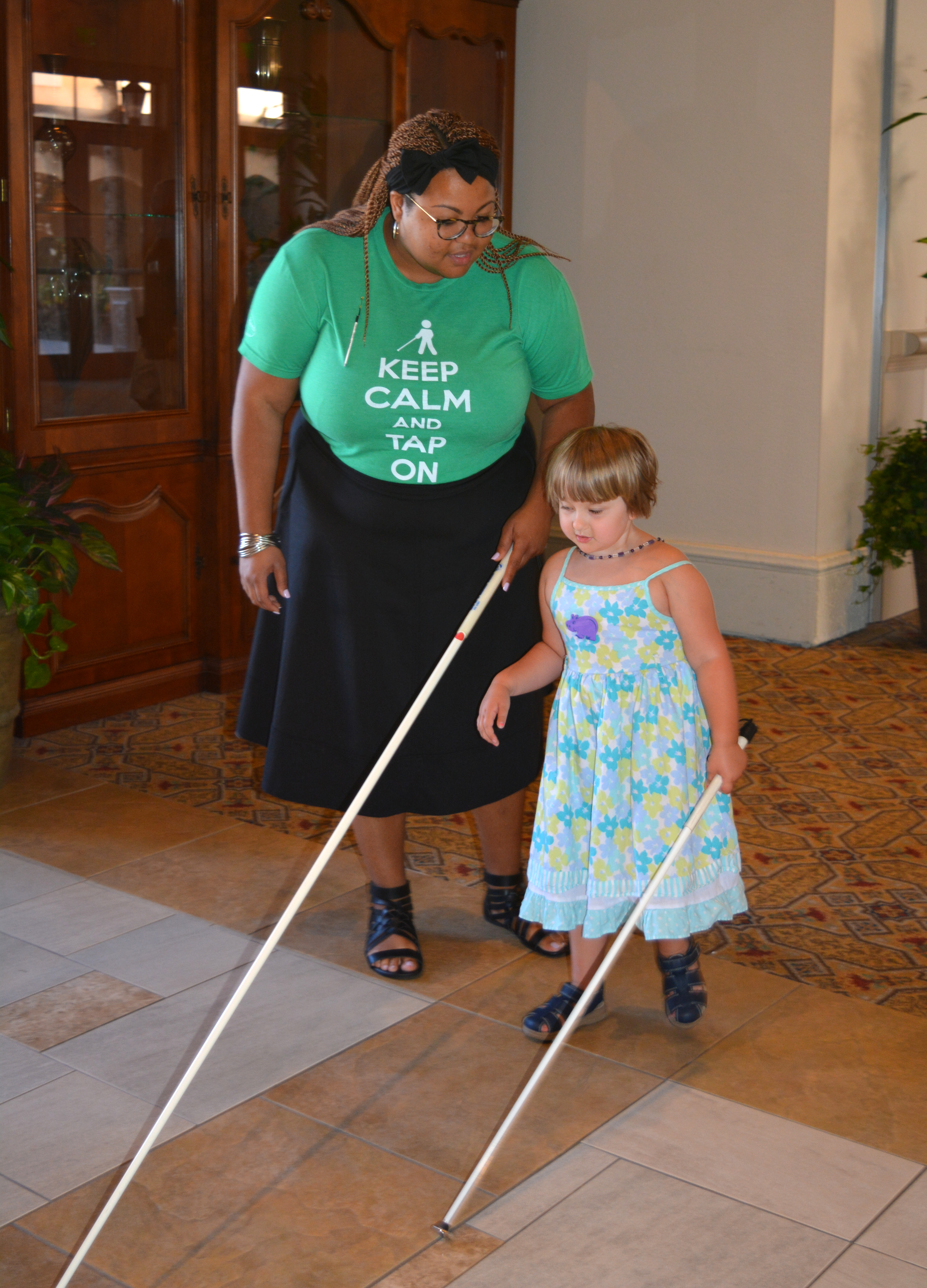 Sheena Manuel gives Daisy Loomis a cane travel lesson