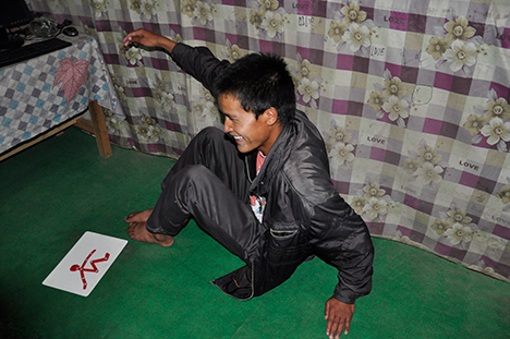 Student recreates Fleximan&rsquo;s pose from a tactile drawing.