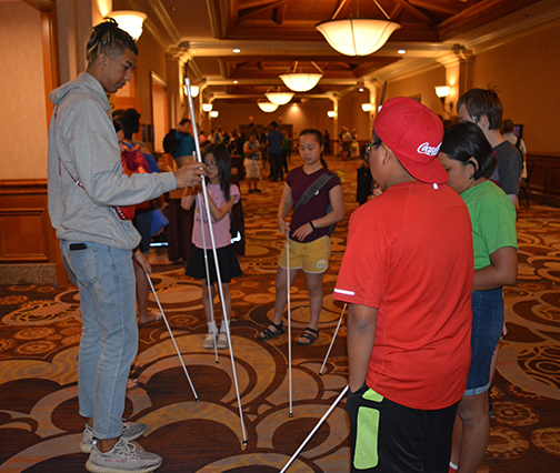 Youth Track students get a basic cane lesson.
