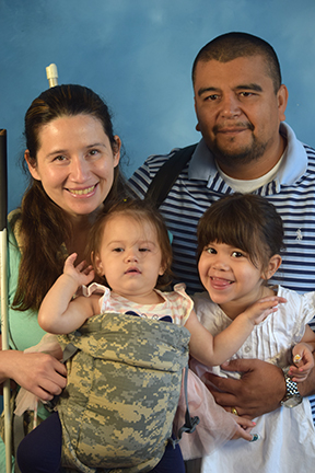 Rosy Carranza and her husband, Marco, pose with their daughters, Camila and Sofia.
