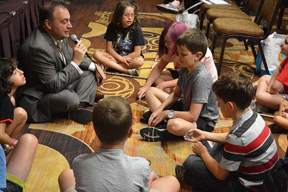 Mark Riccobono answers questions from children at the 2019 NFB National Convention.