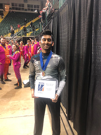 Kinshuk Tella receives an award at Miami University.