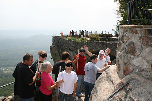Students at the Louisiana Center for the Blind ascend a rocky path to a lookout.
