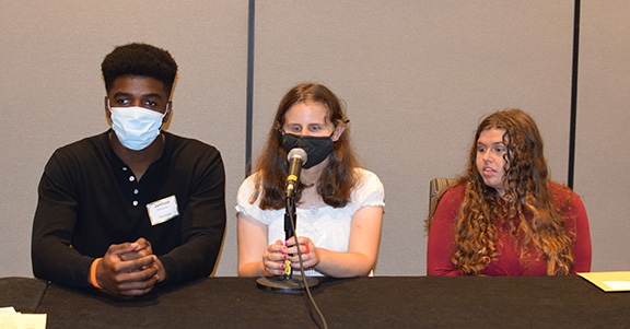 Joshua Olukanni, Lauren Altman, and Tamara Brooks speak on a panel during the NOPBC Seminar.