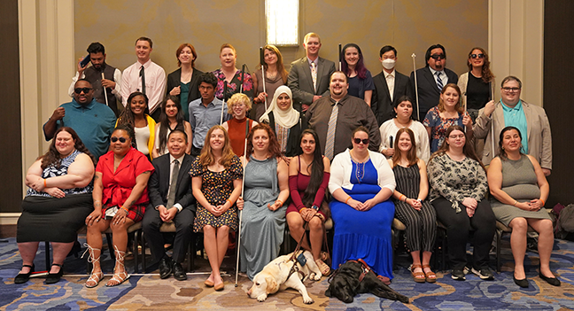 The 2022 NFB Scholarship Class: Front row (left to right): Jennifer Doran, Jovan Campbell, Colin Wong, Sarah Menefee, Emily Schlenker, Stephanie Valdes, Katie Lester, Julia Murray, Katelyn Beresic, and Nancy Aguilera; Middle row: Michael Hardin, Renae Hemmings, Natasha Ishaq, Bhavya Shah, Izzi Guzman, Tasnim Alshuli, Casey Martin, Selene Monjaraz, Katelyn Siple, and Justin Champagne; Back Row: Shawn Abraham, Hunter Kuester, Finn Paynich, Carla Scroggins, Maura Kutnyak, Robert Lamm, Abigail Duffy, Ethan Fung, Daniel Martinez, and Teresa Fabre