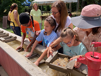 Josefina, Emmanuel, and Cheyenne search for fossils at a dinosaur park with the NFB of Connecticut BELL Academy. Read NFB BELL® Academy: Raising Expectations,
Changing Lives