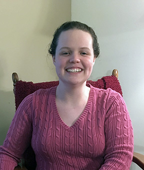 Kayde Rieken relaxes in a rocking chair. 