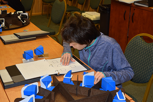 A participant takes the tactile mental cutting test (T-MCT), the instrument designed by SABER personnel to test spatial ability.