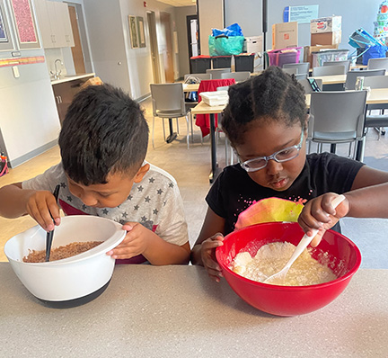 Chicago NFB BELL students mix batter to make brownies.