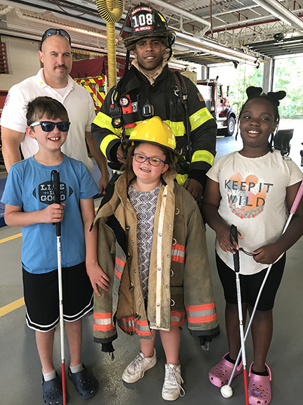 Students in the New Jersey NFB BELL&reg; Academy program visit a firehouse.