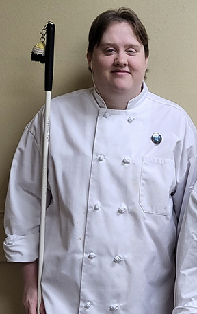 Cameron Loehr is wearing a chef&rsquo;s jacket.