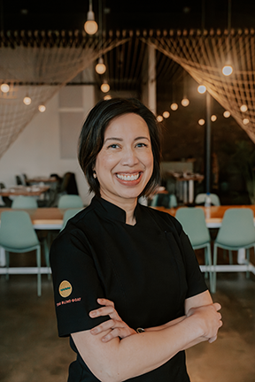 Christine Ha poses in her restaurant.