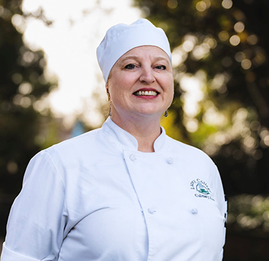 Serena Olsen wearing her chef&rsquo;s uniform.