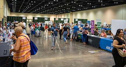 Enthusiastic visitors explore booths in the Exhibit Hall.