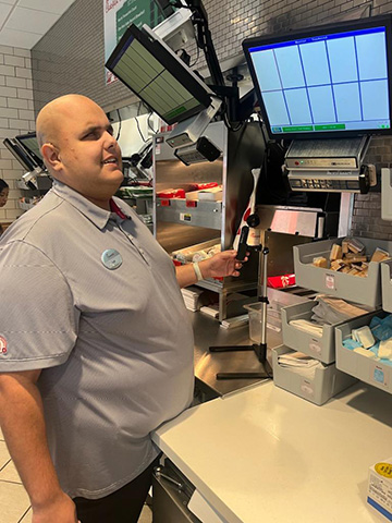 Kyle Chellino fills orders at Chick-fil-A. 