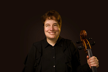 Leslie Hamric sits holding her cello.