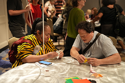 Sharonda Goode and Josh Miele work on an origami project.
