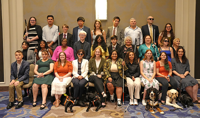 The NFB National Scholarship Class of 2025: Left to right, back row: Erin Daley, Daniel Hernandez, Zoe Marsh, Gene Kim, Juna Gjata, Andrew Lee, Waseem Aljanazreh, Sergio Arvizu Arguelles, Noor Subhi Khraisat; Middle row: Katiana Urbina, Mary Nix, KaShonia Graham, Kaleb Calhoun, Rasheedah Kenner, Toby Harnish, Millie Rivera, Emily Schlenker, Riley Letterman, Joy Orlando; Bottom row: Ryan Lukowicz, Ghania Oussaci, Mandy Smith, Ren Lovegood, Kaelyn McColl, Nicole Quibol, Akliesia Teshome, Caitlyn Head, Lauren Altman, Izzy Bailey. 