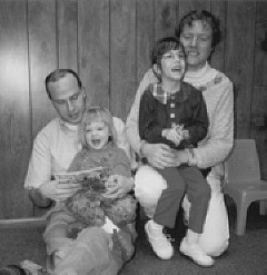 Nathan and Lydiah Schuck, with daughtes May an Amy, take a break in the Children's Room while touring the National Center for the Blind, headquarters of the National Federation of the Blind, Baltimore, Maryland