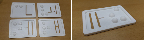 Figure 4. Examples of 3D literacy aids for a few Hangul characters, each aid depicting the raised braille letter on one side and a stencil outline of the letter as it would be hand written on the other.