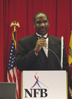 Anil Lewis addresses the banquet audience.