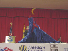 President Maurer draws aside the drape revealing Whozit.