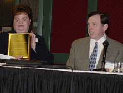 Mary Willows, displaying her award, and Steve Benson