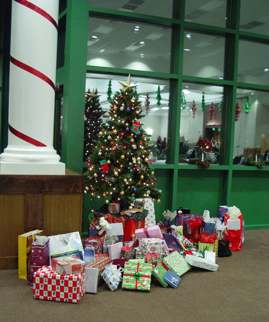 The tree and gifts pictured here are ready for the staff holiday party.