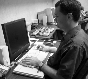 Josh Boudreaux supervises students in the computer lab.