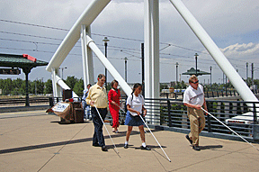 Dan Frye, Barbara Pierce, Kishia Mason, and Brent Batron leave the light rail station on their way to find the public library.
