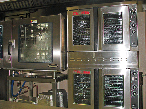 The two convection ovens stacked one atop the other are on wheels for easier cleaning.