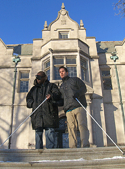 Zach Ellingson works with Maurice Crittendon on travel outside the mansion.